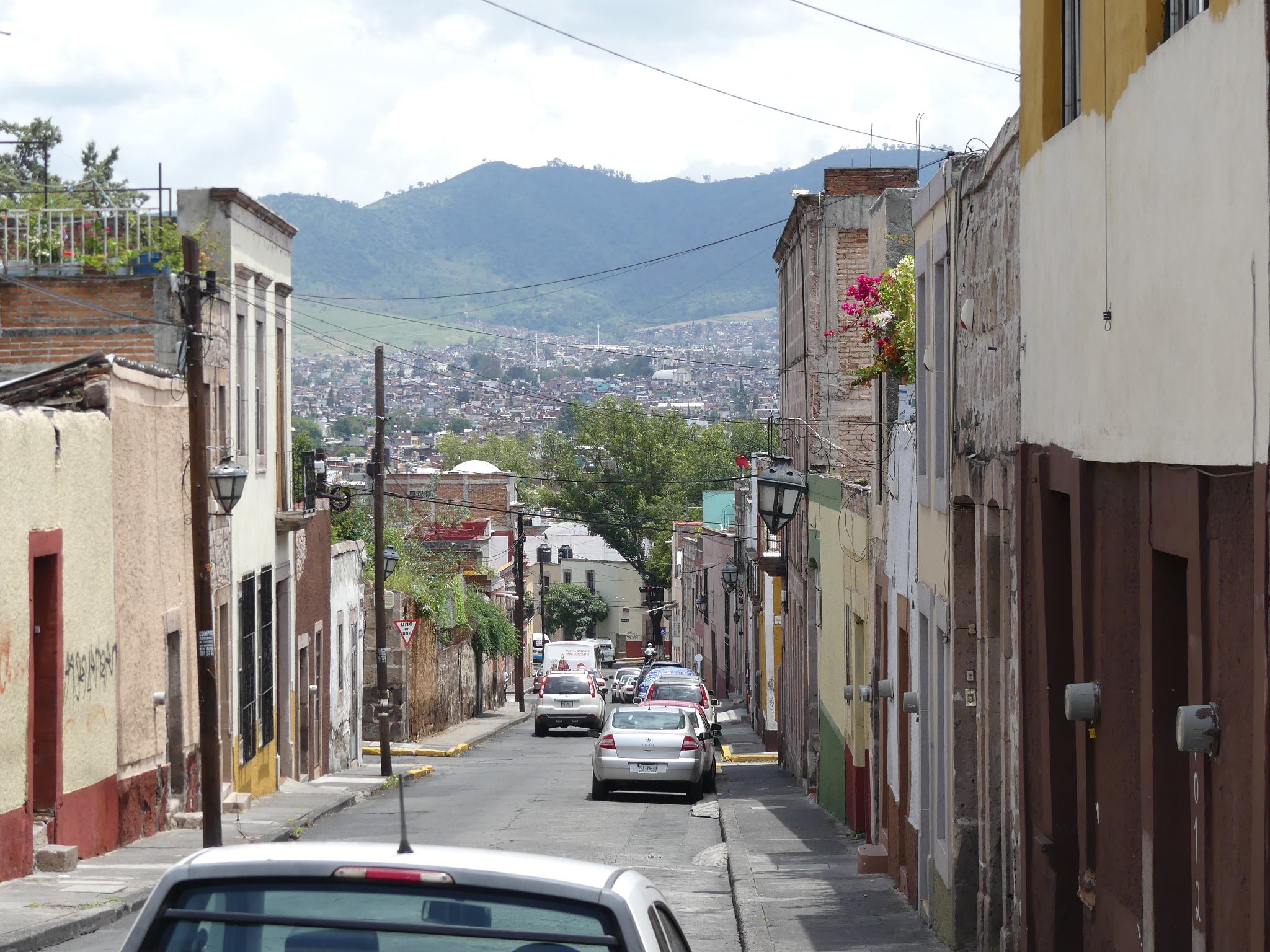 Morelia, City street, cars, hills, houses